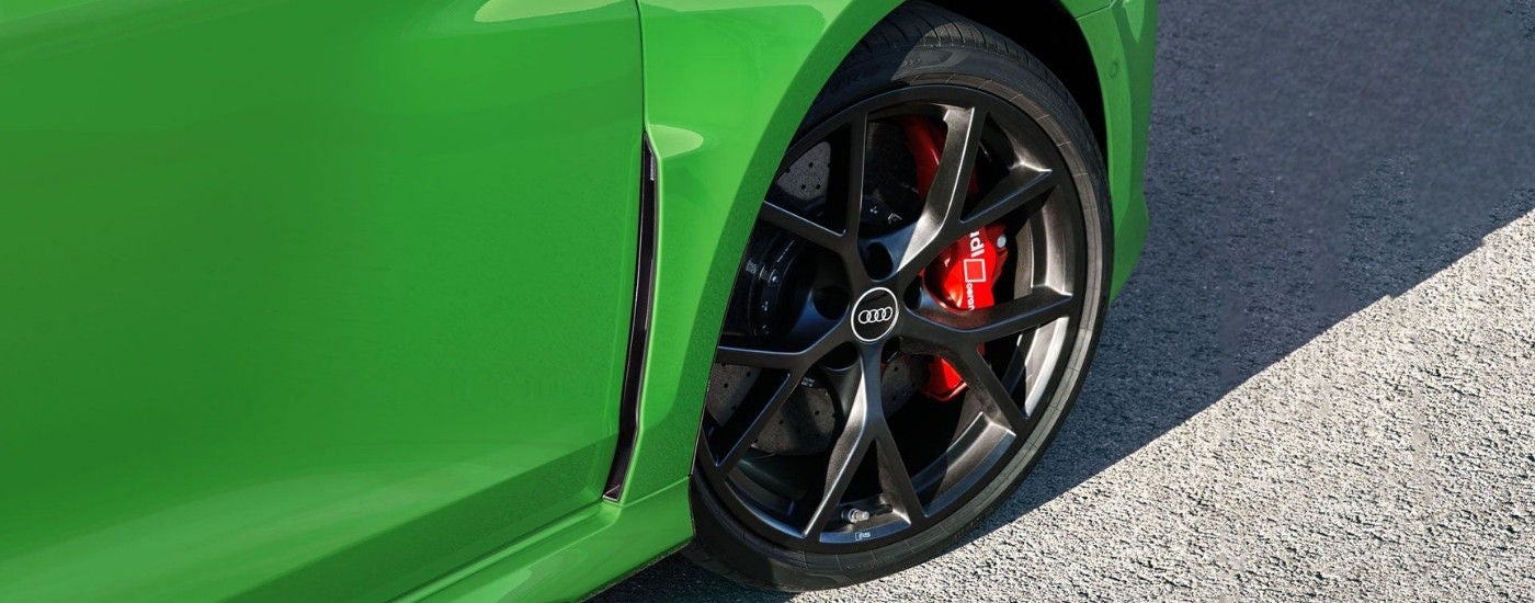 Black wheel on a green 2025 Audi RS 3.